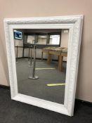A painted white traditional style mirror,