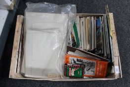 A crate of local tourist guides, Geordie phrase booklets,