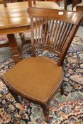 A set of thirteen early twentieth century mahogany dining chairs with comb backs.