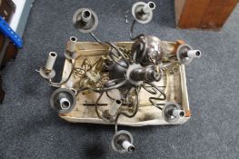 A crate of brass light fittings