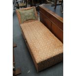 An Edwardian upholstered storage chaise longue