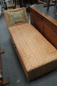 An Edwardian upholstered storage chaise longue