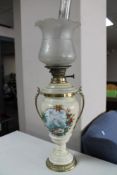 A 19th century ceramic and glass oil lamp