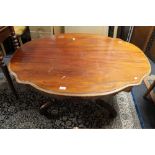 A Victorian mahogany shaped low table