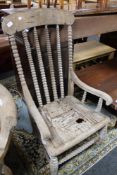 A nineteenth century wooden armchair with bobbin turns