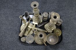 A tray of brass lamps, candlesticks,