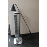 A Comaco floor standing fan together with an angle light