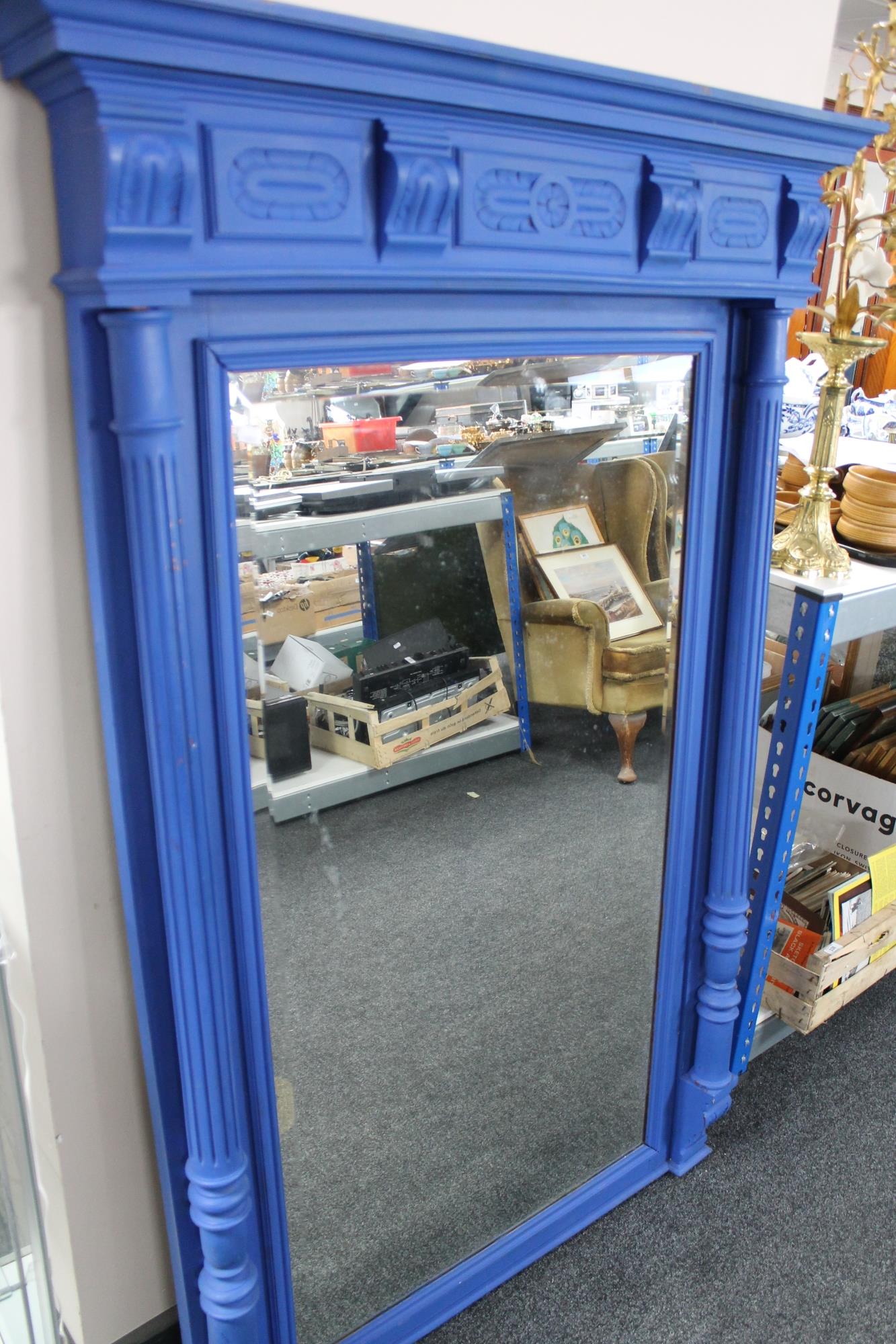 A painted blue antique style bevelled mirror 103 cm x 155 cm