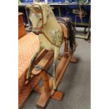 A mid century painted wooden rocking horse CONDITION REPORT: Overall height 97cm.