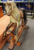 A mid century painted wooden rocking horse CONDITION REPORT: Overall height 97cm.