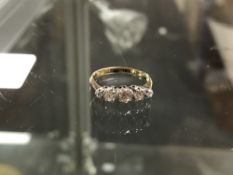 An 18ct gold five stone diamond ring, size G1/2 CONDITION REPORT: 1.