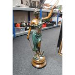 A large patinated metal figure - 'Justice', holding a sword and scales , height 79 cm.