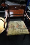 An inlaid mahogany armchair together with a coffee table