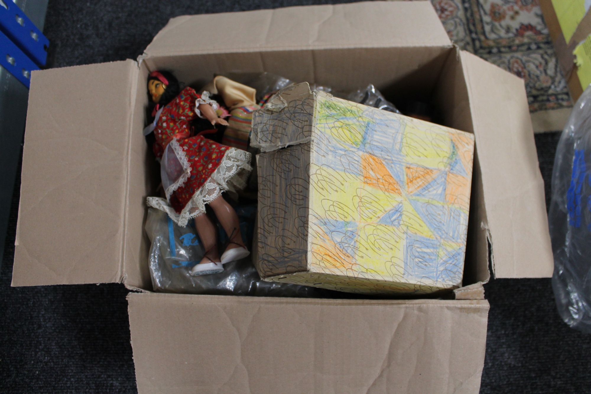 A box of vintage dolls,