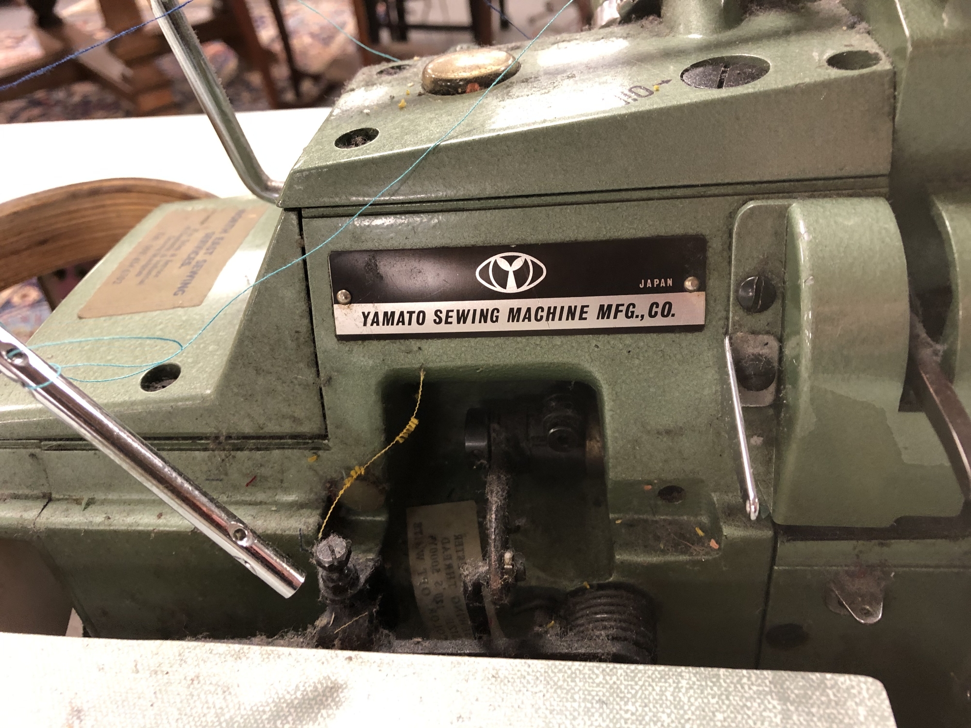 A Yamaha Industrial overlocking sewing machine in table - Image 2 of 2