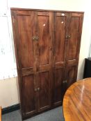 A contemporary hardwood double door storage cabinet 100 cm width, 158 cm height and 20 cm depth.