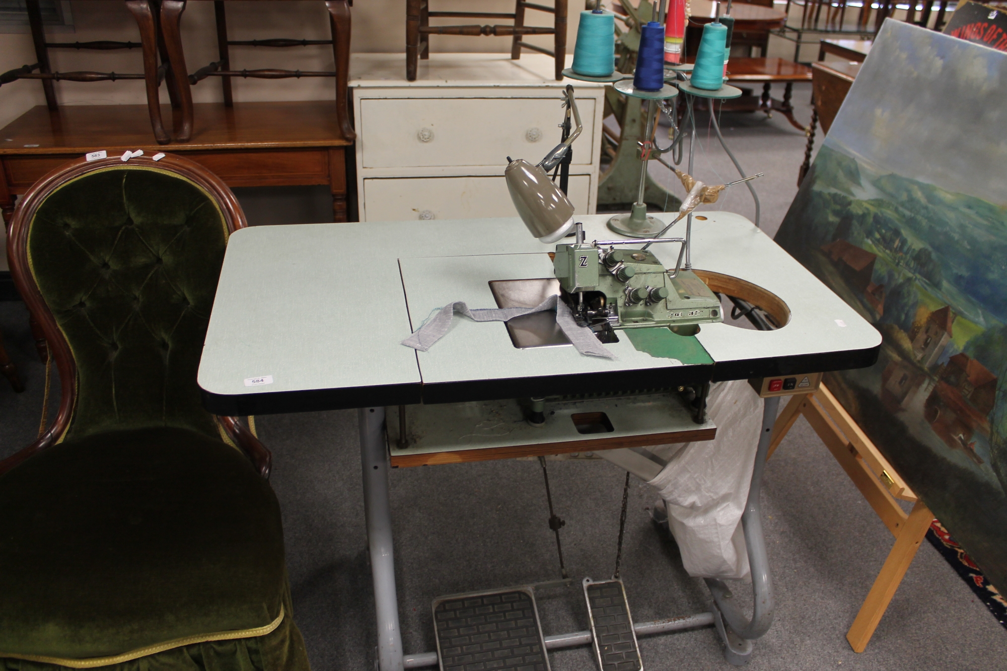 A Yamaha Industrial overlocking sewing machine in table