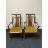 A pair of mahogany armchairs