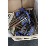 A crate of metal bench vice