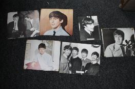 A small quantity of photographs and press cuttings relating to the Beatles, one bearing signatures.