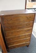 A mid century stained beech six drawer chest