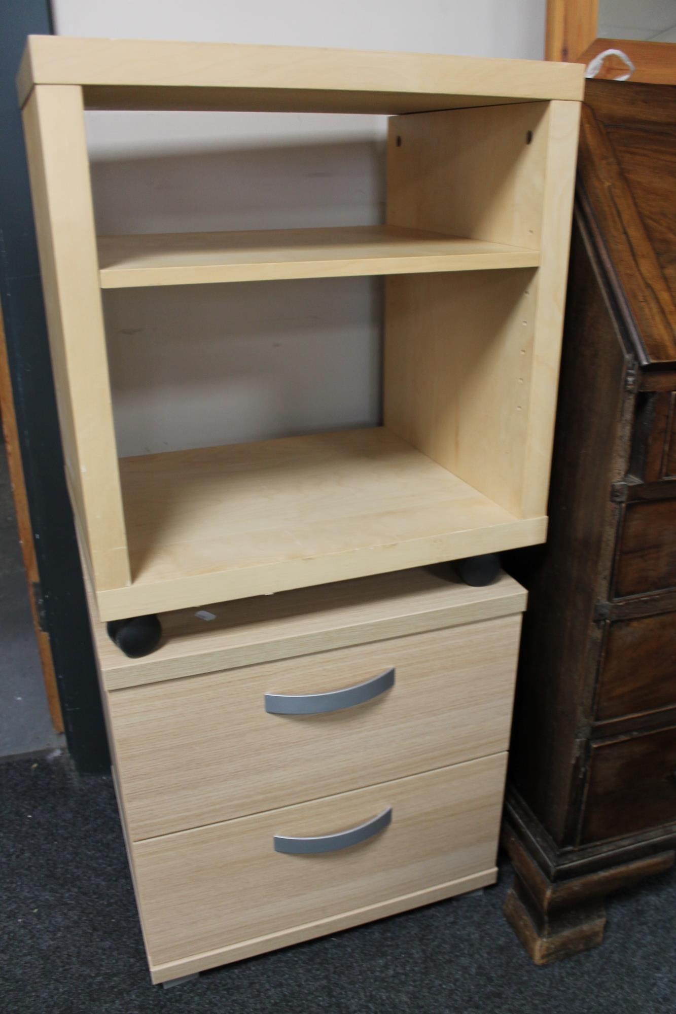 A beech two drawer cabinet and stand