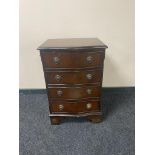 A reproduction mahogany four drawer bow fronted chest
