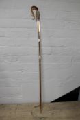 A glass twist stem walking cane