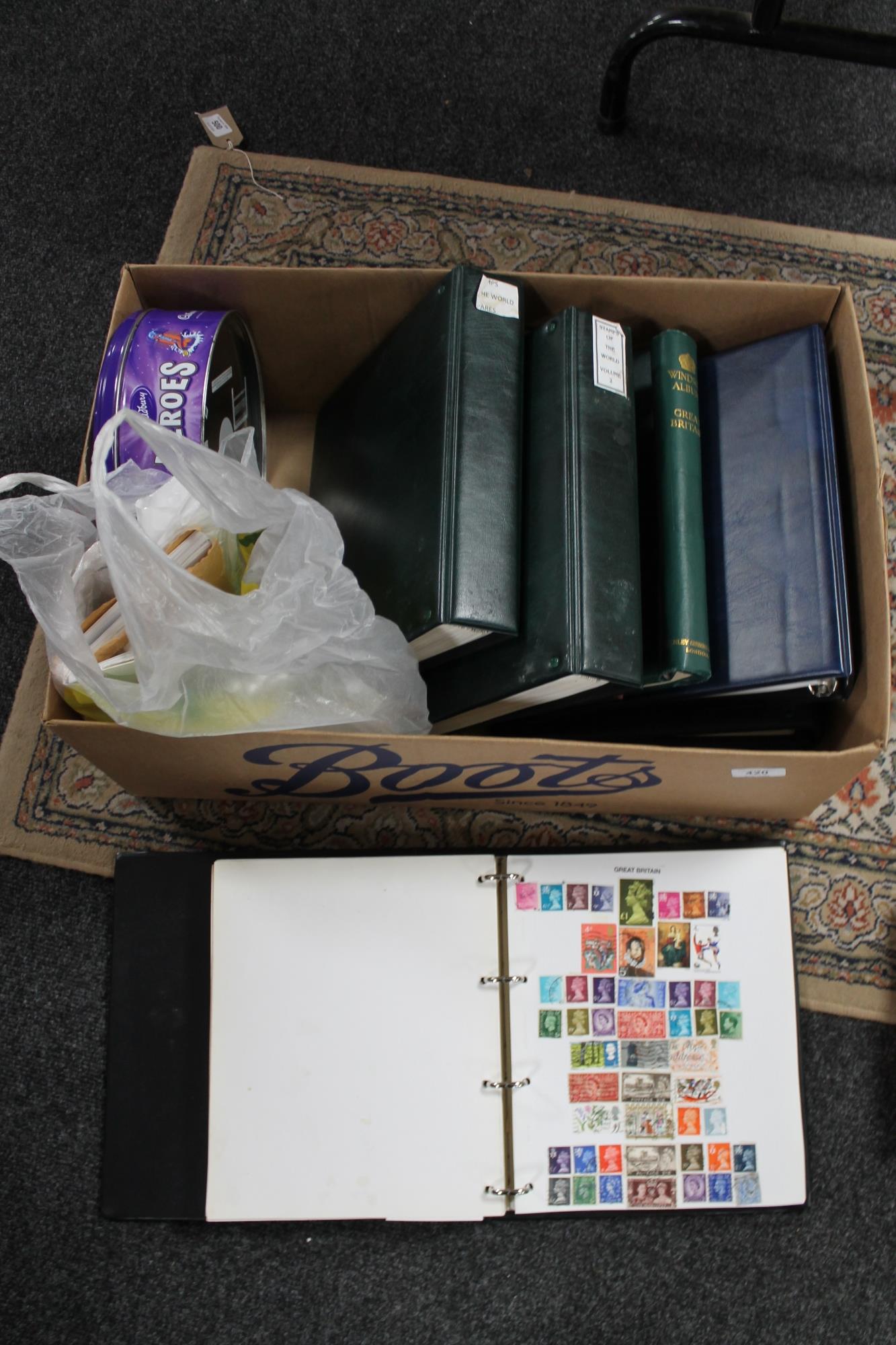 A box of stamp albums and stamps