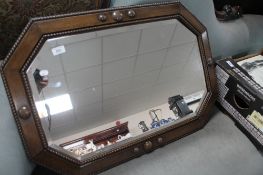 An Edwardian oak framed mirror