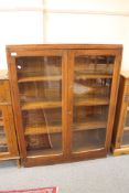 An Edwardian oak bookcase , width 99 cm.