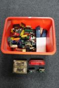 A box of die cast vehicles and model cars and D-shaped cabinet