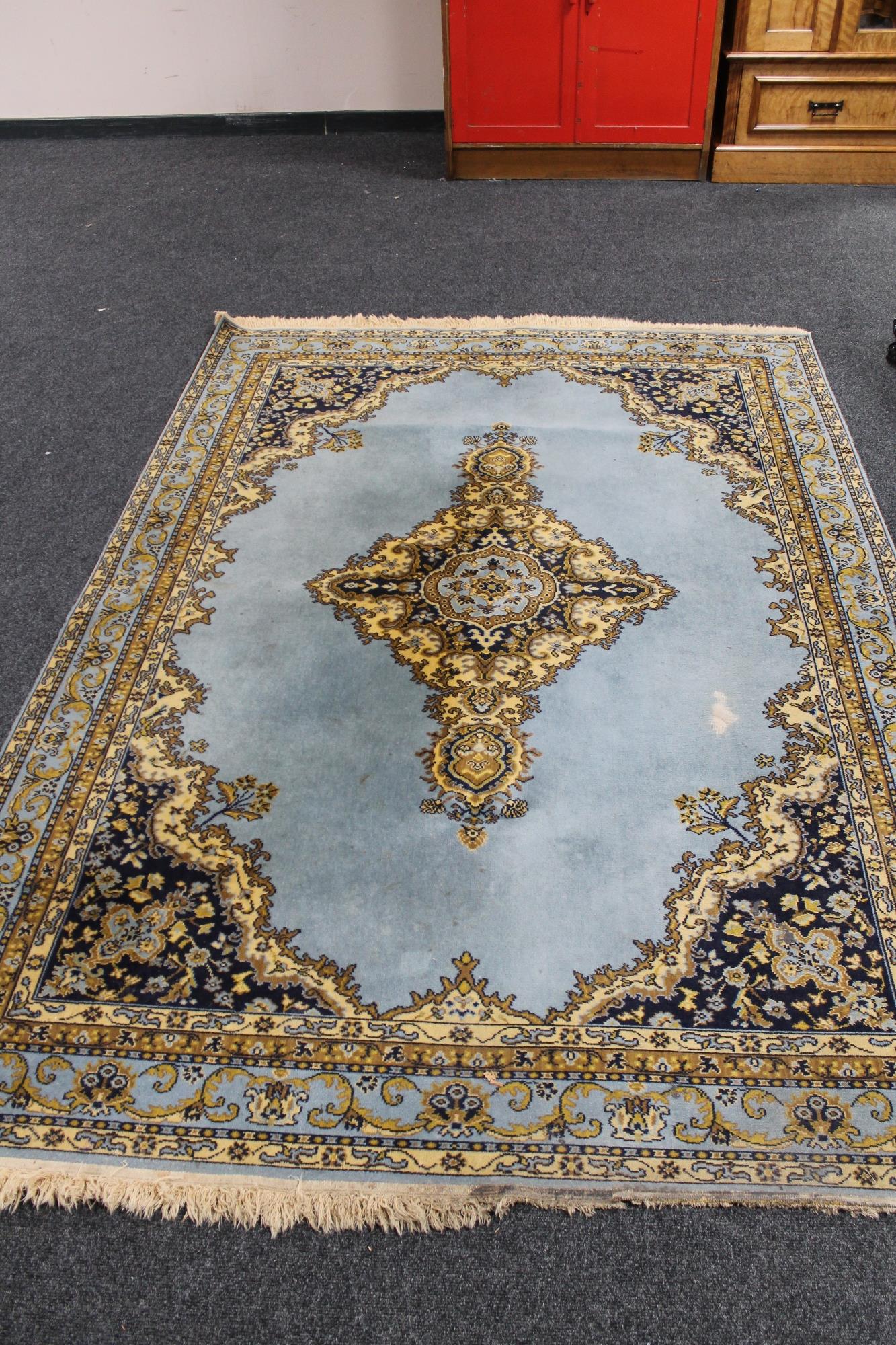 An Indian carpet on duck egg blue ground