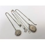 Two silver lockets and a silver pendant,