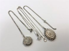 Two silver lockets and a silver pendant,