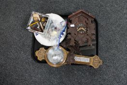 A carved oak barometer, cuckoo clock, box of pipes,
