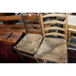 A pair of nineteenth century ladder backed chairs