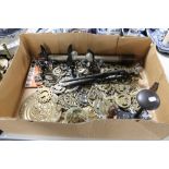 A box of brass, horse brasses, metal lights,