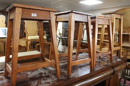 A set of four pine stools