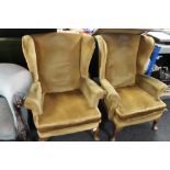 A pair of dralon mustard coloured armchairs
