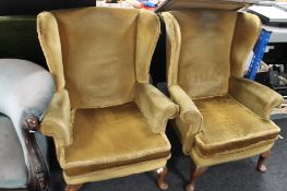 A pair of dralon mustard coloured armchairs