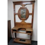 An Edwardian carved mahogany mirrored hall stand