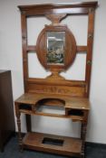 An Edwardian carved mahogany mirrored hall stand