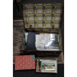 A vintage suitcase containing a large quantity of stamps