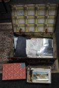 A vintage suitcase containing a large quantity of stamps