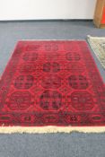An Afghan Bokhara carpet 230 cm x 162 cm
