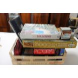 A crate of board games, jigsaw puzzles,