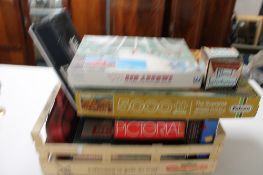 A crate of board games, jigsaw puzzles,