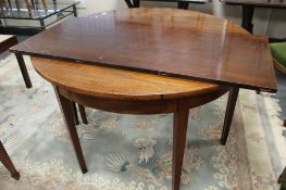 A nineteenth century mahogany extending dining table with leaf