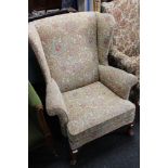 A reproduction Queen Anne style armchair in floral covering
